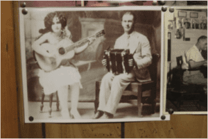 A photograph of Joe Falcon and Cléoma Breaux, the first couple to record Cajun music, is tacked to the wall at Randy Falcon's accordion shop in Judice, La. Randy is Joe's second cousin. Photo Credit: Leslie Westbrook, The Daily Advertiser
